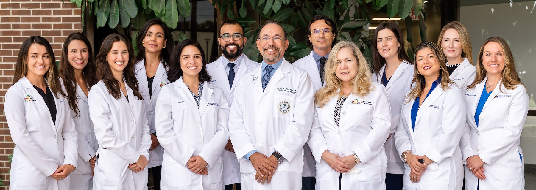 Group of doctors and nurses together for a team photo in a Pediatric Epilepsy & Neurology Specialists Tampa Florida