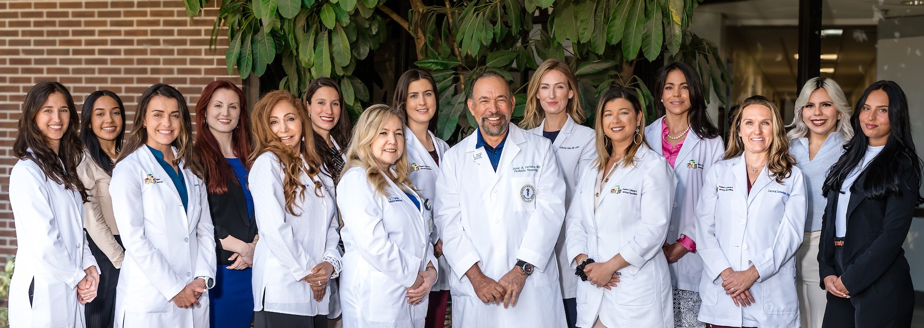 Group of doctors and nurses together for a team photo in a Pediatric Epilepsy & Neurology Specialists Tampa Florida